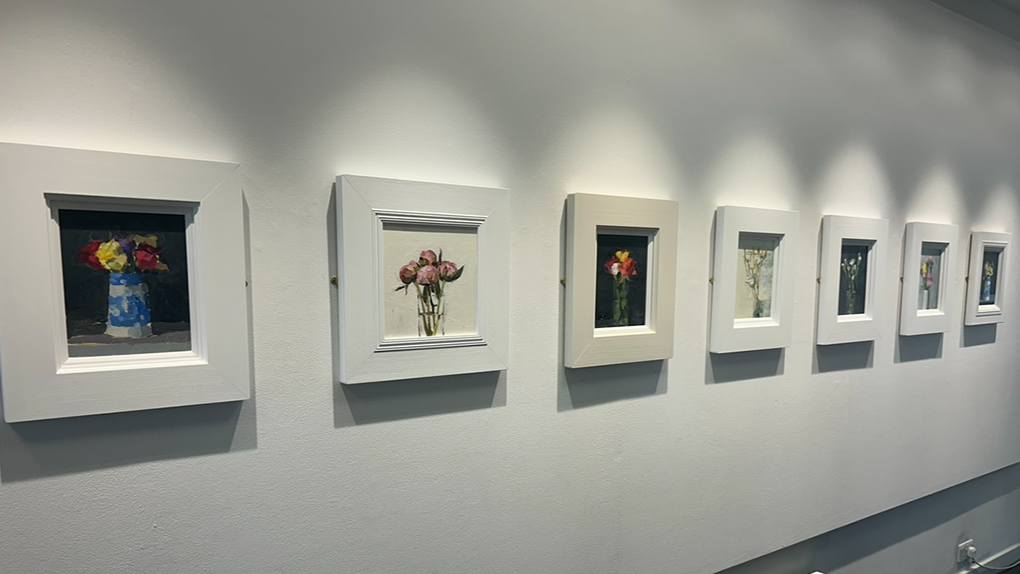 Seven artworks on the wall of the Harbour Arts Centre, part of David Reid's exhibition
