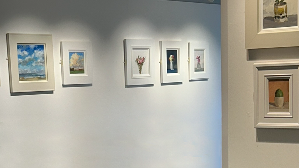 Seven artworks on the wall of the Harbour Arts Centre, part of David Reid's exhibition