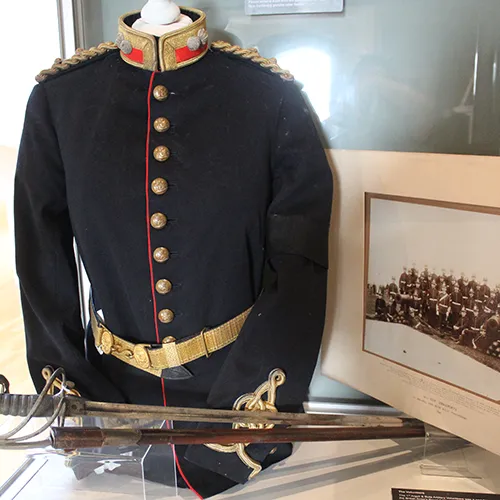 Historic military uniform with sword.
