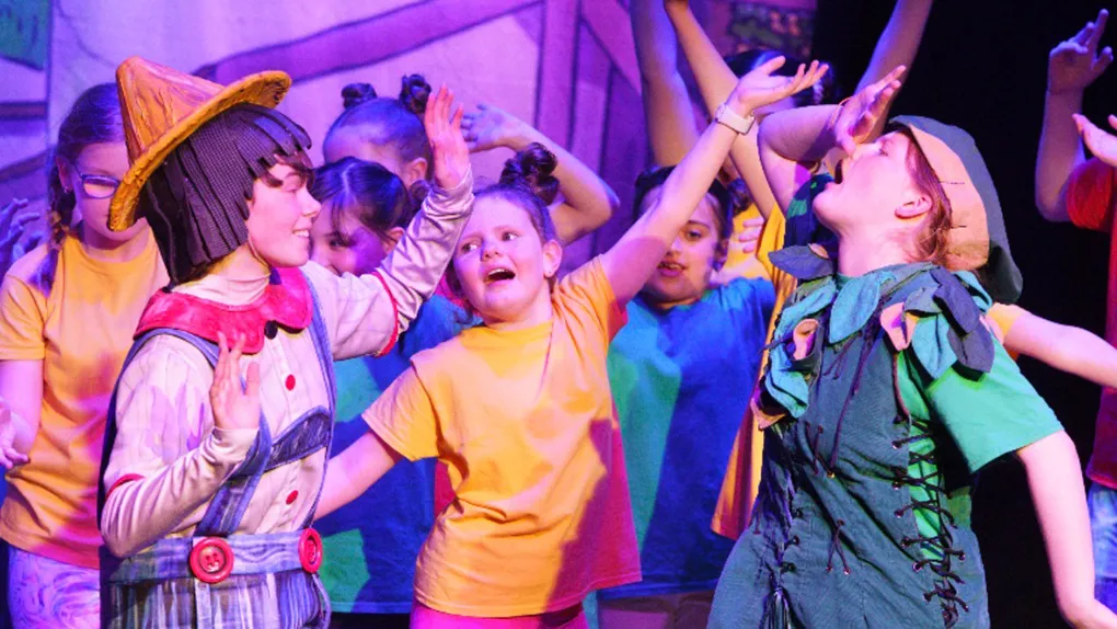 Primary age children taking part in a drama production
