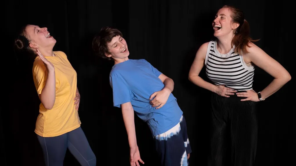 Secondary age children acting out laughing